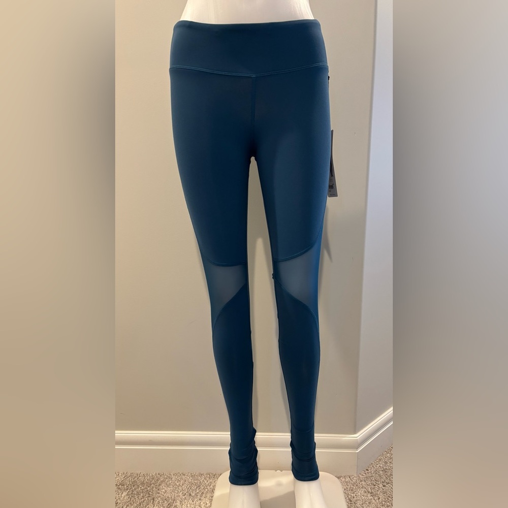 ALO Yoga Coast Leggings in Blue with mesh detail and stirrup foot stirrup detail